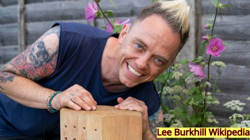 Lee Burkhill Wikipedia profile image showing garden designer in a natural garden environment.